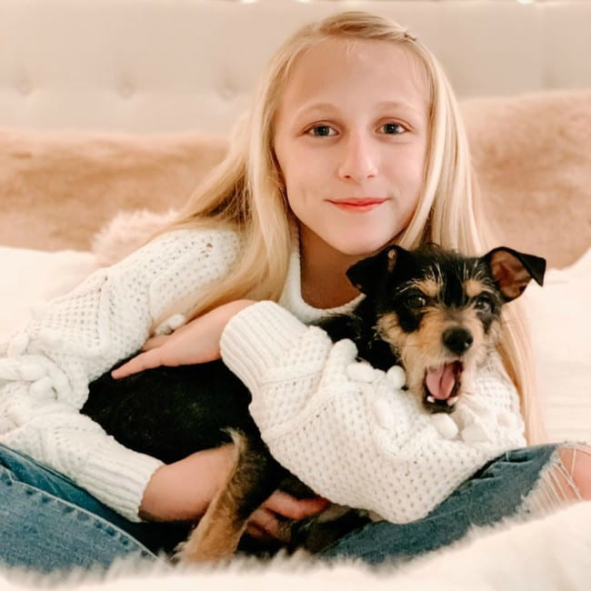 Clara Lukasiak with her dog as seen in December 2019