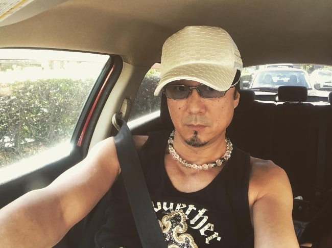 Takaya Kuroda clicking a car selfie
